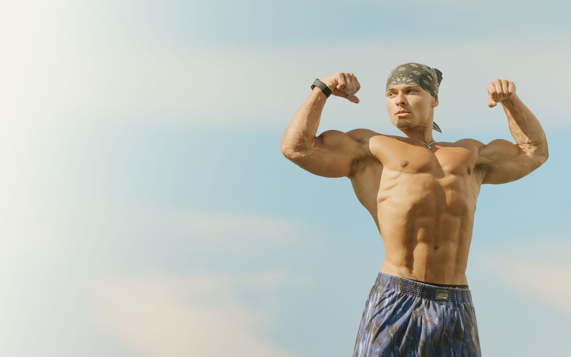 Christian Elliott double bicep flex outdoors